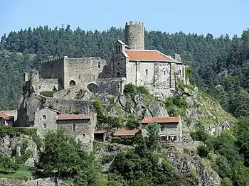 View of the Château de Chalencon to the left and the tower behind the chapel.