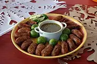 Salvadoran chorizo with lime and a dip