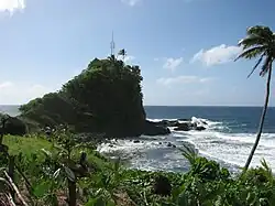 Local surfing spot, nicknamed Plum Pudding Rock, by Solosolo.