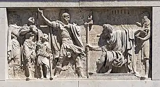 Bas-relief on the facade left, by Bartolomeo Ferrari.