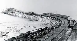 Steam tram motor hauling coal wagons across Bulli Jetty c. 1900