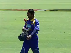 A man wearing blue Sri Lankan jersey