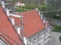 A church roof under repair with terracotta tiles