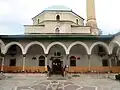 The sahn (courtyard) of the mosque along with the riwaq and entrance to the mosque