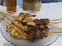 Cooked sate kambing (right) have darker colour compared to chicken satay (left)