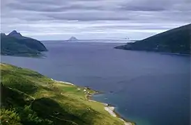 View near Nesna, Norway, showing the settlement of Lillevik in the foreground. The island of Lovund in the distant horizon.