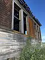 Side of abandoned 1906 schoolhouse in Govan