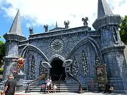 The haunted castle-themed building facade that serves as Scooby-Doo Spooky Coaster's entrance.