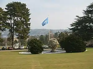 The Celestial Sphere Woodrow Wilson Memorial in the Ariana Park with Lake Geneva in the background.