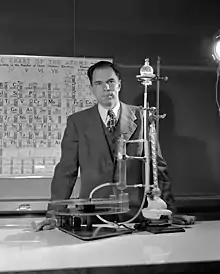 Glenn T. Seaborg in his Berkeley Laboratory, in front of a Hubbard periodic table chart (pictured 1950)