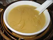 Photo of shark fin soup in bowl with Chinese spoon