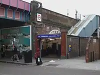 high-level station up stairs on brick viaduct near the market