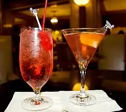 Image 33Mixed drinks: a non-alcoholic Shirley Temple (left) and alcoholic Cosmopolitan (right) (from List of drinks)