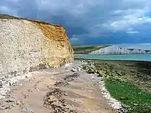 Buff rock at the top of a cliff