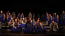 A show choir competing on stage in 2017.