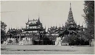 black and white photo of a monastery compound with two connected multitiered wooden roofs