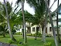 Side view of Hulihe`e Palace through the palm trees. (10/2012)