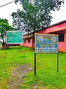 A view of Science Block & Sign boards showing college map & NSS of KSGM College Nirsa