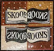 Floor mosaic showing the Skoob Books' logo.