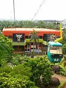 Tourists take a ride on this cable car to enjoy bird-eye view of this park