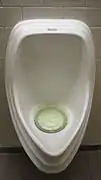 Waterless urinal in California