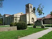 A school building with clock tower.  An announcement board "South Pasadena Middle School" is visible.