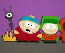 A crudely animated cartoon image of an obese child with a red jacket, brown pants, black shoes and a blue hat. Flames appear from the rear of his body, as well as a tall vertically shaped machine with a single eye and two antennae. Standing next to him is another boy wearing an orange jacket, green pants, brown shoes, a green hat and gloves.