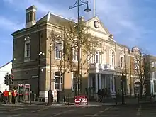 A large Georgian-era building with a white portico