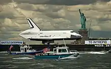 Enterprise moving up the Hudson River to the Intrepid Museum