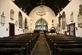 13th-century nave with 16th-century pews