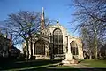 From the east, tall seven-light chancel window flanked by two five-light aisle windows, all three from 1498