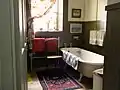 Bathroom and clawfoot bath. The window overlooks the driveway