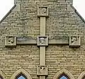 Cross on west wall showing symbols of Evangelists