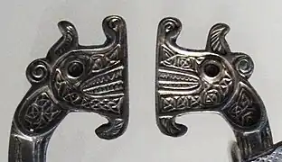 Zoomorphic brooch terminals