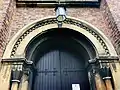 Dog-tooth ornamentation above the Neo-Norman west door