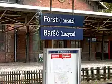 Bilingual station sign in German and Lower Sorbian: Forst (Lausitz)/Baršć (Łužyca)