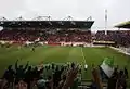 Wolfsburg players celebrate a victory with fans at Stadion am Bruchweg.