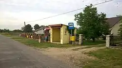 Bus stop decorated with local motif.