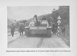 Soldiers surrounding a tank