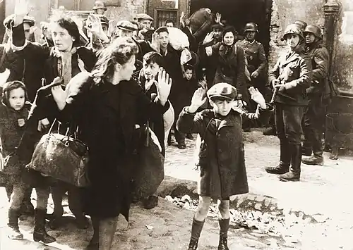 Warsaw Ghetto Uprising, April 1943: Jews being held at gunpoint by SS troops (from a report written by Jürgen Stroop for Heinrich Himmler)