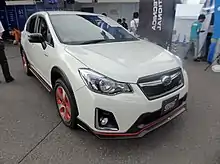 Subaru XV Hybrid tS, a high-performance variant of the Subaru XV Hybrid. This photo shows the front of the car, which is white with a small "STI" emblem on the front grille.