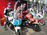 Winners Presentation 2012 Super-Twin Manx Grand Prix – Nigel Moore (2), Brian Mateer (4) & Michael Sweeney (7) TT Grandstand Wednesday 29 August 2012