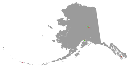 Oultine of map of Alaska with colored dots representing the location of Superfund sites in the state