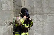 A firefighter in Toronto, Canada wears a Nomex hood in 2007.