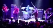 Blurry photo of the Get Up Kids onstage