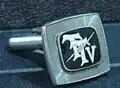 First version of TTV logo on a cufflink for senior executives