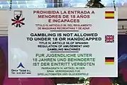 This warning sign in a gambling place in Tenerife, Spain uses  for the Spanish text,  for the English text and  for the German text.