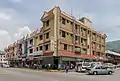 Row of contemporary shophouses in Tenom, Malaysia