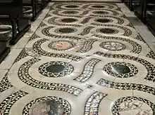 Uneven worn pavement, central nave of the Duomo di San Cesareo in Terracina, southeast of Rome