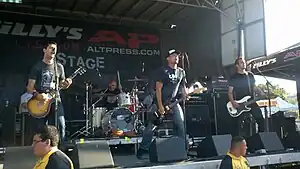 The Black Pacific performing on the 2011 Warped Tour. Left to right: Orrell, Vega, Lindberg, and Caswell.